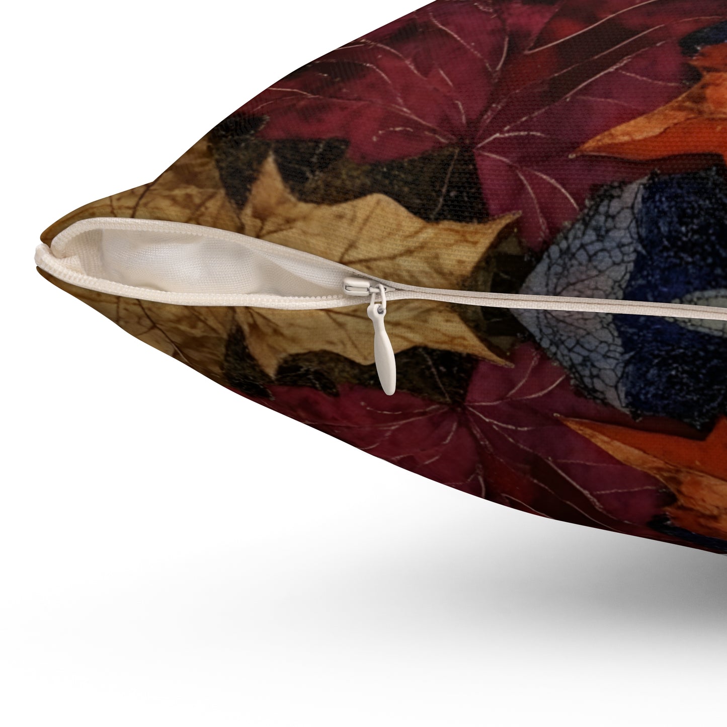 Decorative pillow with leaf pattern and zipper on a white background